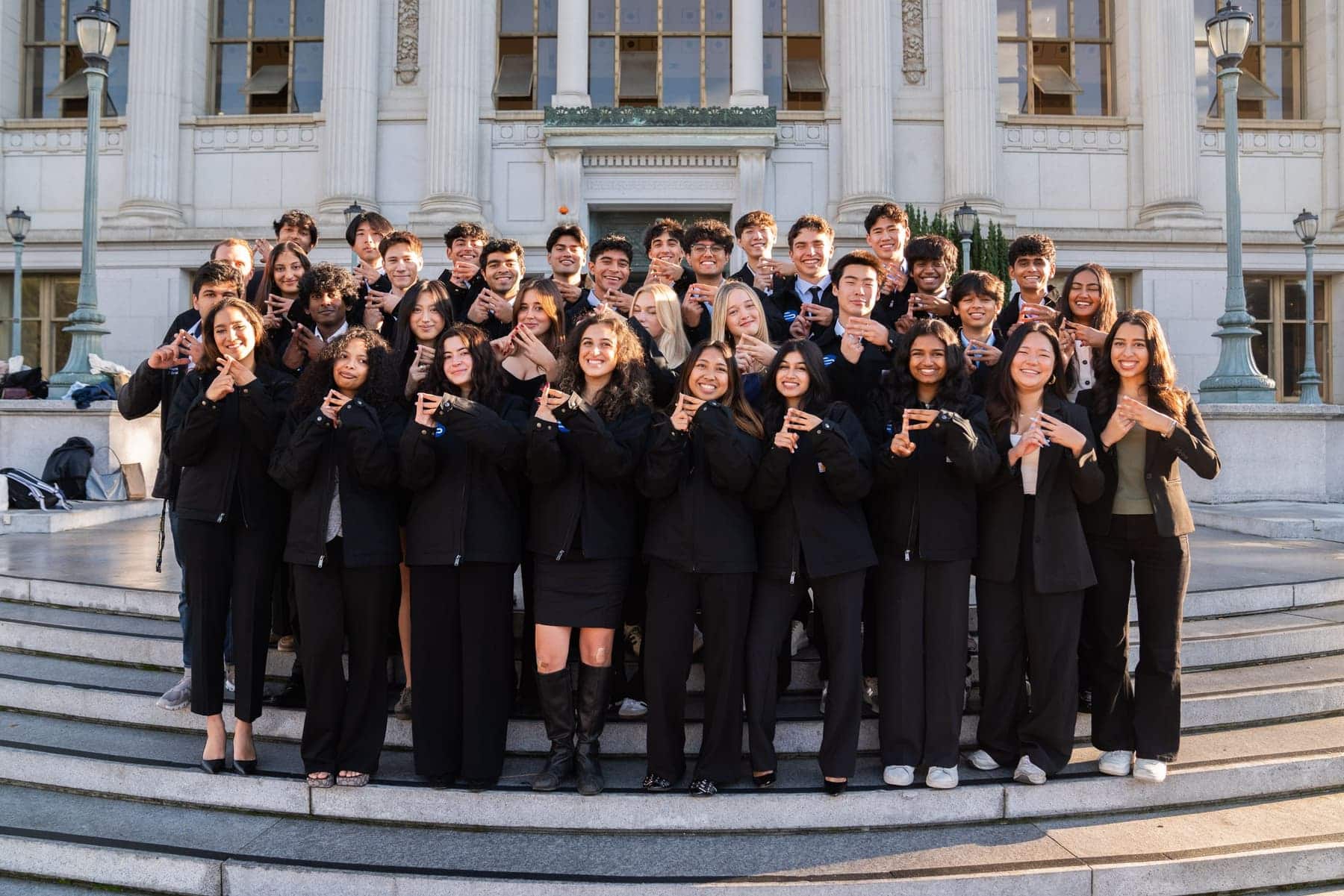 Entrepreneurs @ Berkeley members making the E@B hand sign
